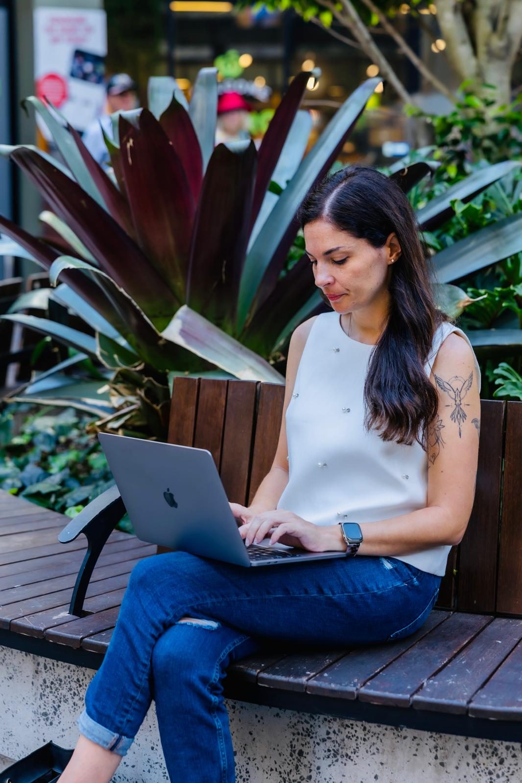 Recruiter working on a laptop outdoors